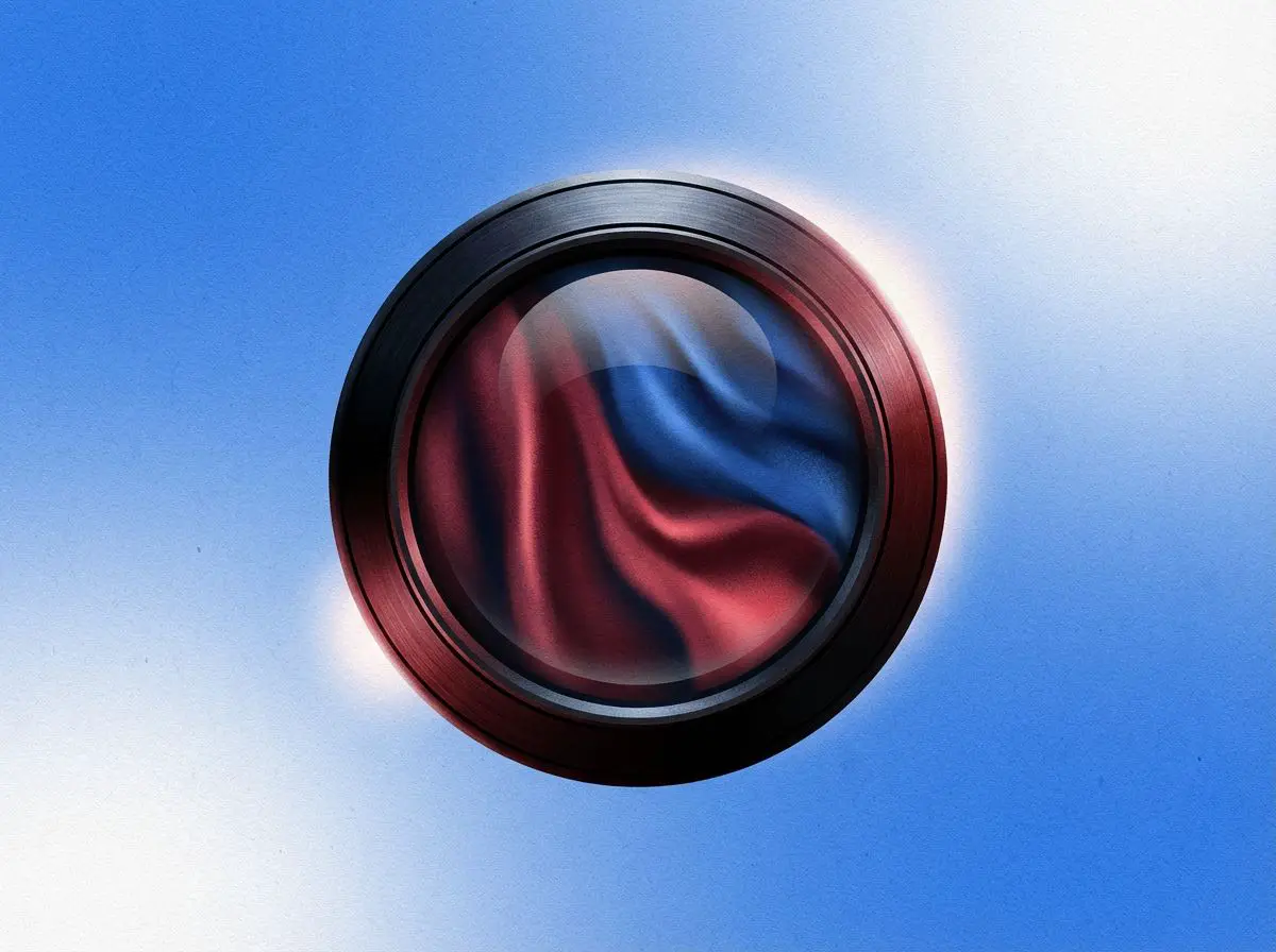 Camera lens filled with flowing red and blue fabric