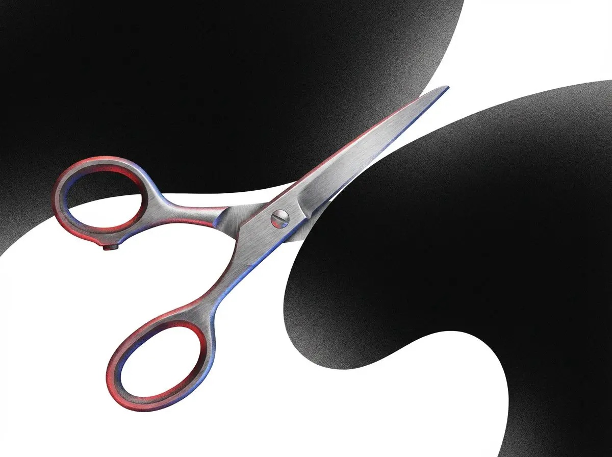 Metal scissors over a black and white swirl background
