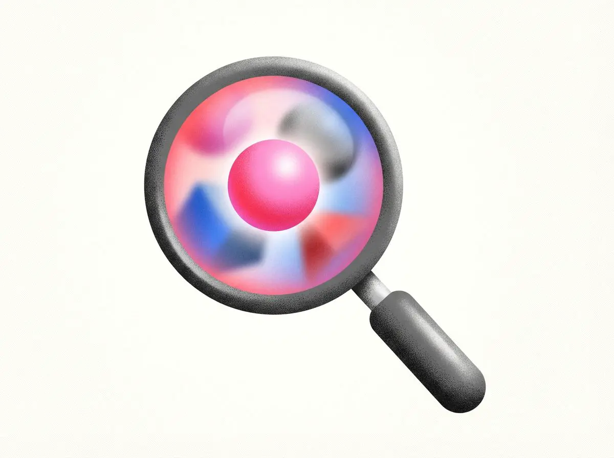 Magnifying glass focusing on a pink sphere among blurred shapes